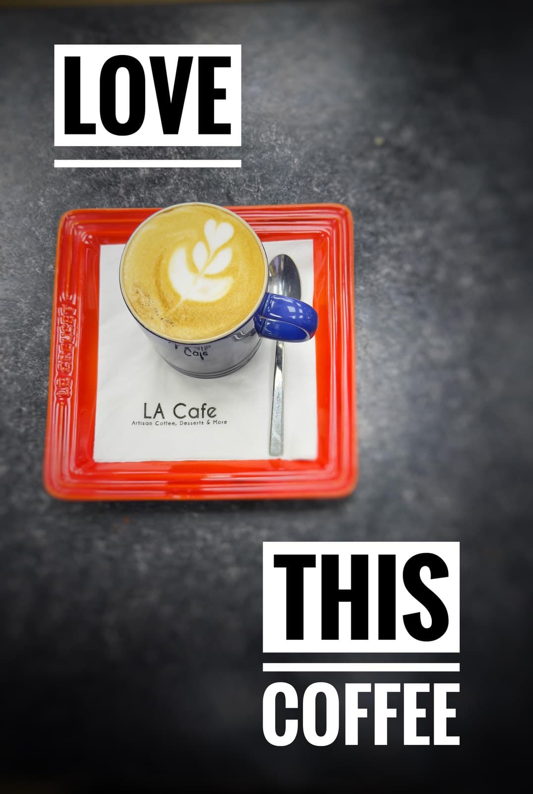 Flat white with heart latte art on LA Cafe napkin